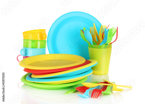 bright plastic disposable tableware isolated on white
