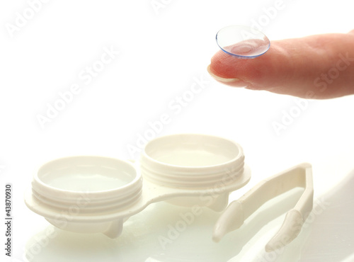 contact lenses in containers and tweezers  isolted on white