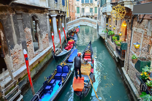 typical urban view with canal, boats and houses in Venice © cescassawin