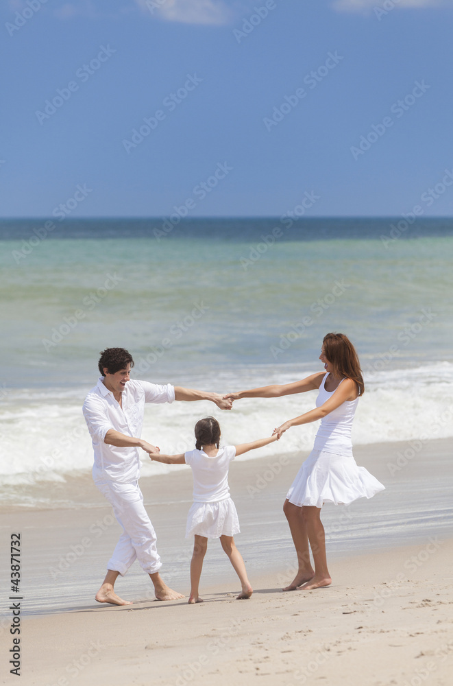 Mother, Father & Child Family Playing Having Fun At Beach