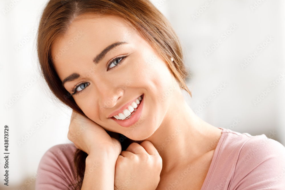 Close-up portrai of an attractive young woman smiling Close-up portrai of an attractive young woman smiling