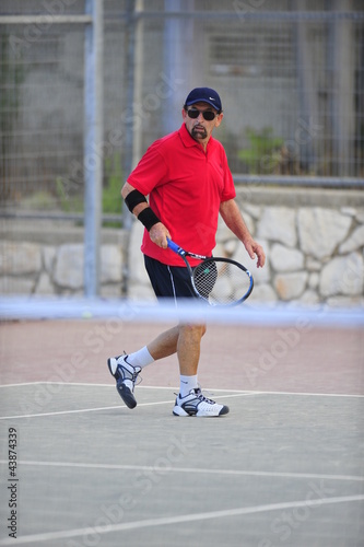 Middle-Aged Tennis Player © PROMA