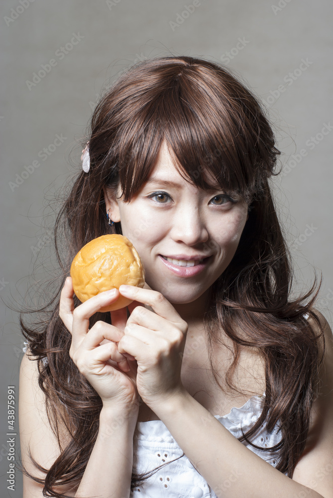 hungry beautiful girl eats a tasty hamburger