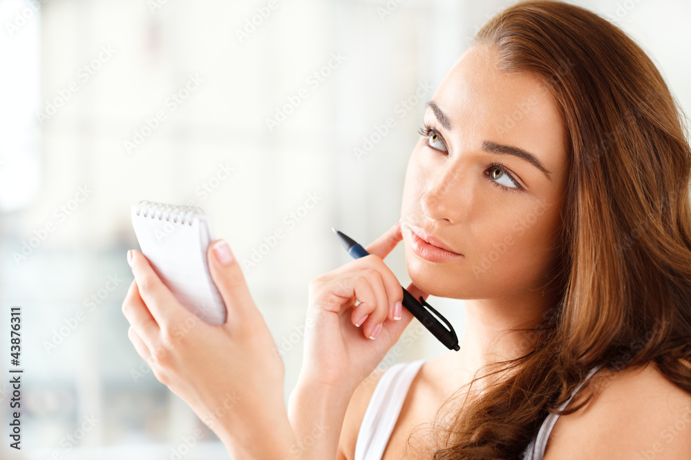 Attractive young student planning ahead Attractive young student planning ahead