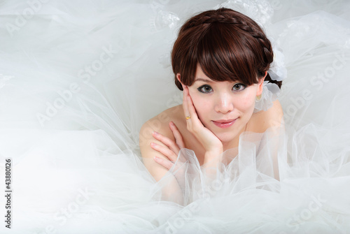 bride sitting in wedding dress, studio shot