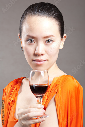 Beautiful woman with glass red wine