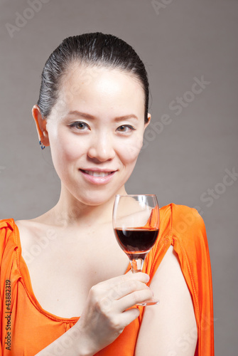 Beautiful woman with glass red wine