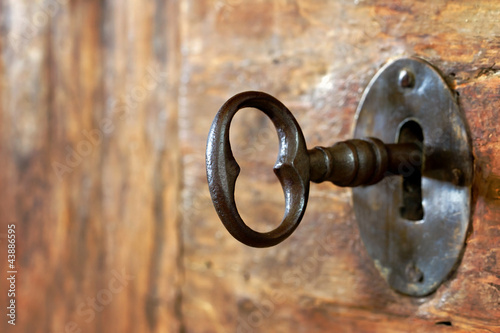 Closeup of an old keyhole with key