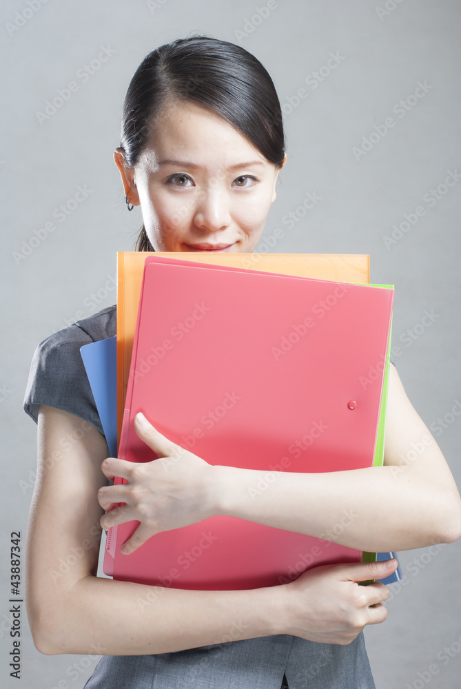 bright picture of beautiful woman with folders bright picture of beautiful woman with folders