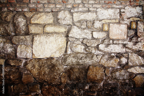 The background of the old masonry with traces of the former migh photo