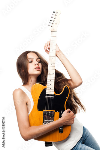 Beautiful young woman with electric guitar
