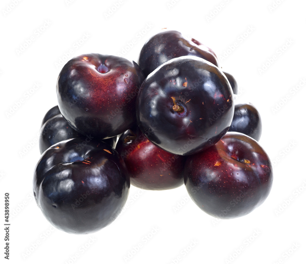 Group of plums on white background