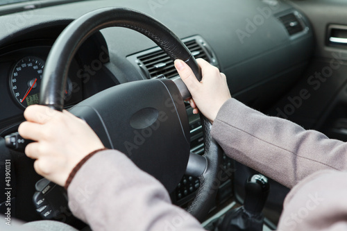 Right hands position on steering wheel during driving a vehicle © Kekyalyaynen