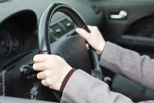 Right hands position on steering wheel during driving a car © Kekyalyaynen