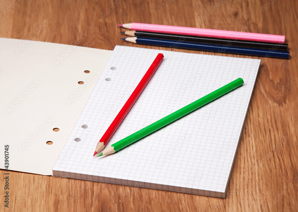 pencils and notebook on wooden table pencils and notebook on wooden table
