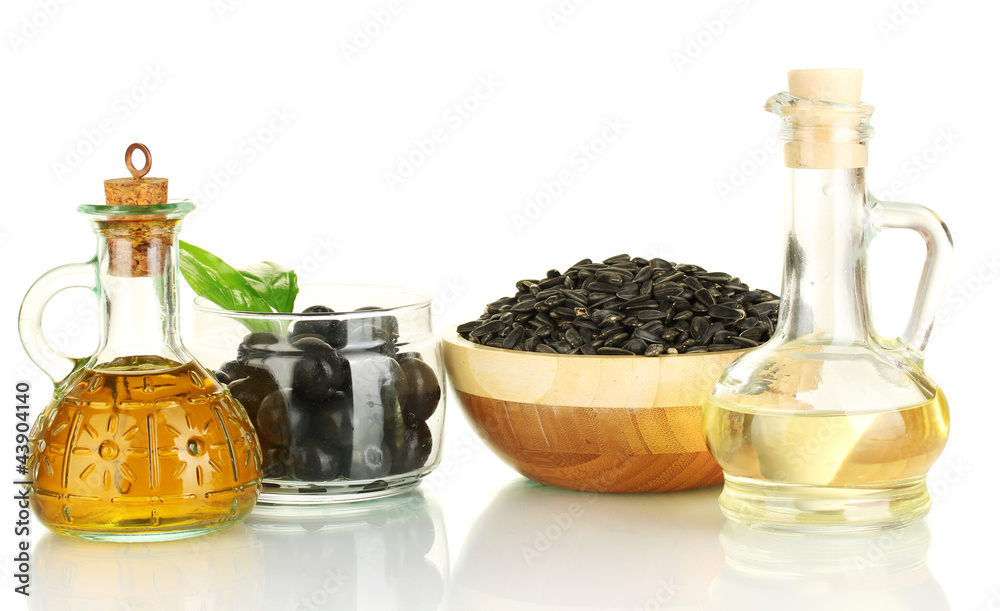 Olive and sunflower oil in the small decanters isolated on