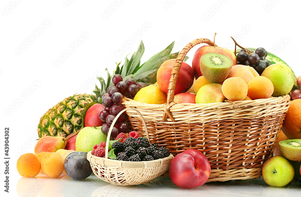 Assortment of exotic fruits and berries in baskets isolated Assortment of exotic fruits and berries in baskets isolated
