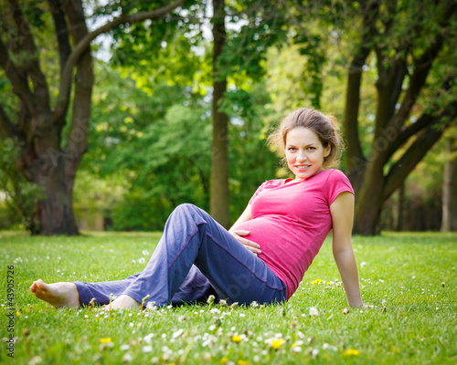 Beautiful pregnant woman in the park © sborisov