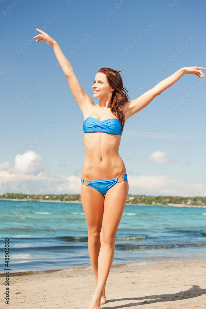 happy smiling woman walking on the beach happy smiling woman walking on the beach