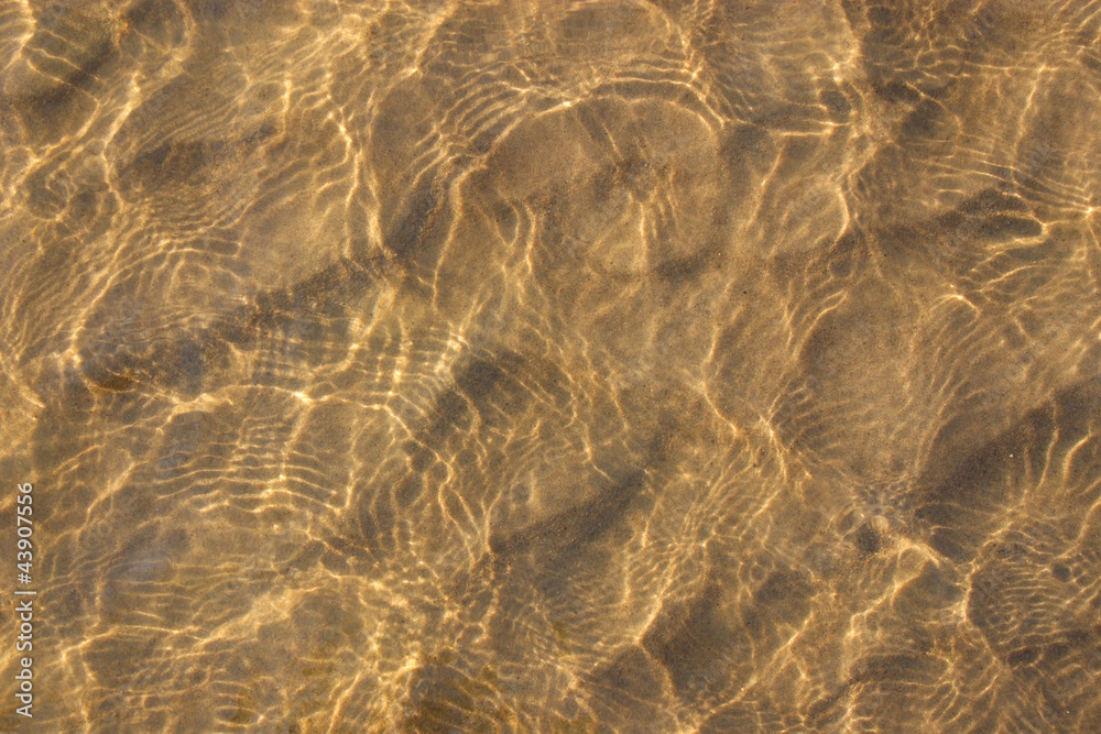 Fototapeta Water of the river with sand