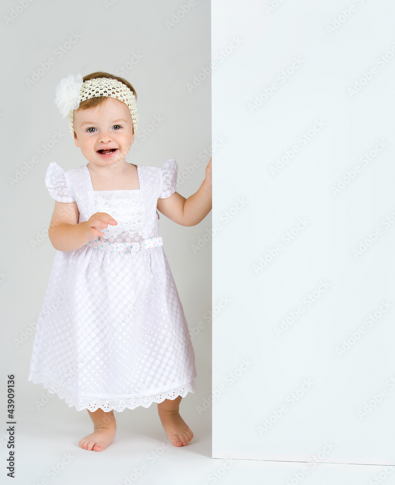 Studio Isolation of an Infant Child. The baby girl is Isolated o Studio Isolation of an Infant Child. The baby girl is Isolated o