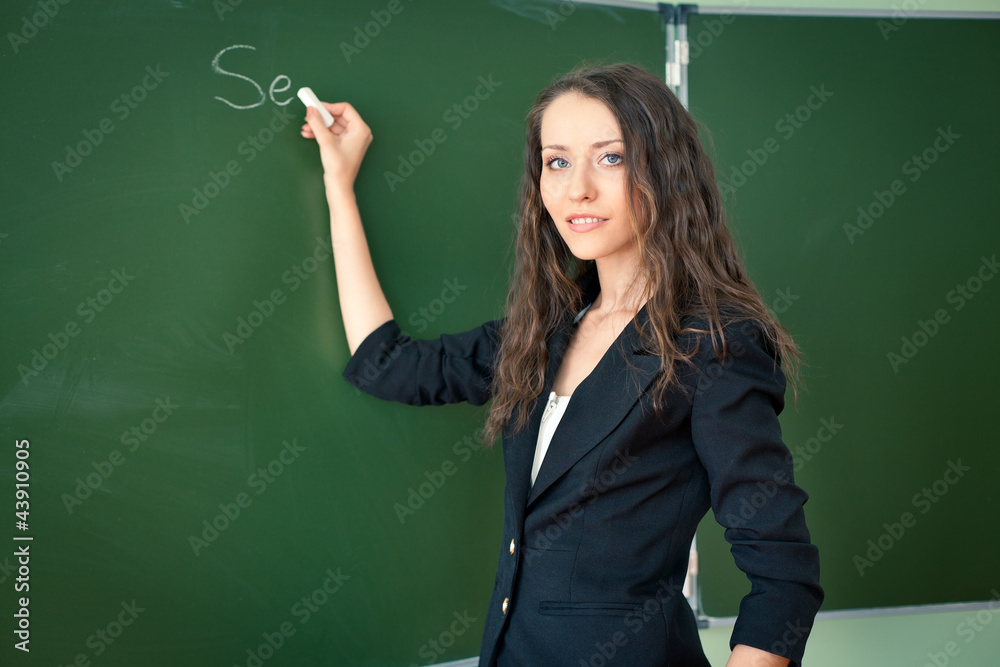 woman writing on blackboard