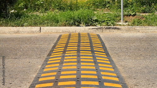 Speed bump on a road when a car is passing