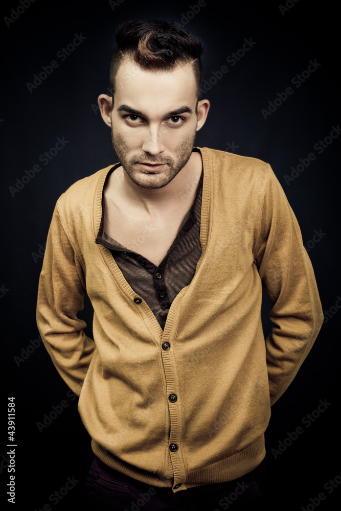 handsome elegant young fashion man on dark background