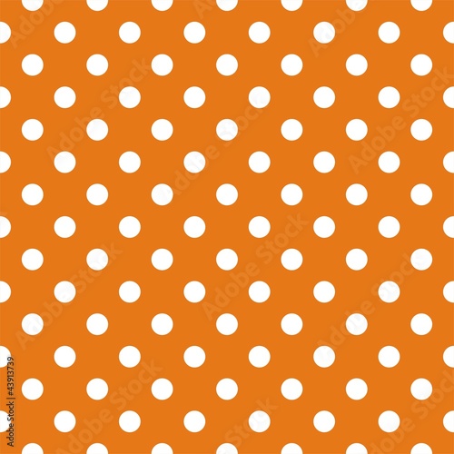 Seamless vector pattern with white polka dots orange background