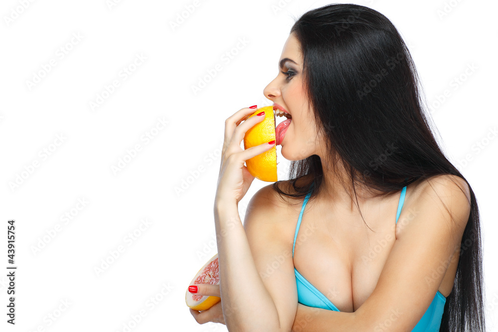 Girl in a turquoise swimming suit with orange on a white Girl in a turquoise swimming suit with orange on a white