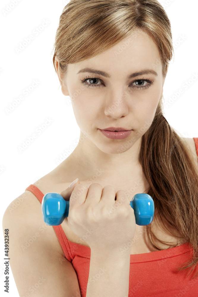 hübsche blonde sportlerin trainiert mit einer fitness hantel hübsche blonde sportlerin trainiert mit einer fitness hantel