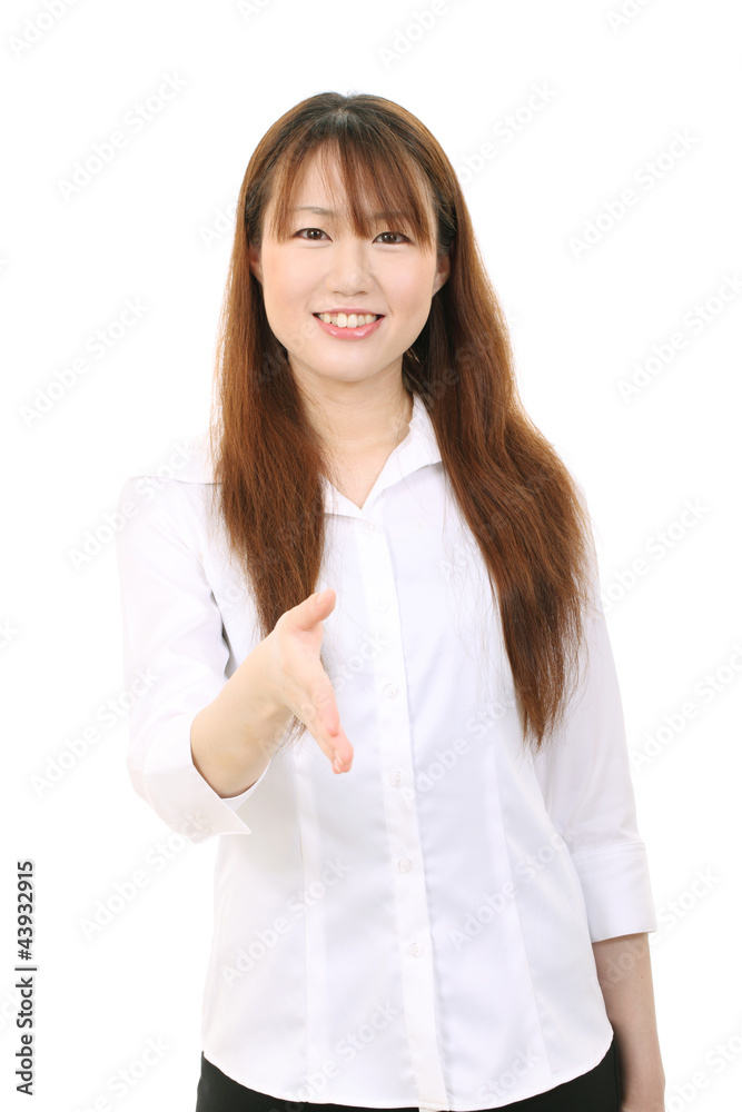 Young asian businesswoman offering handshake Young asian businesswoman offering handshake