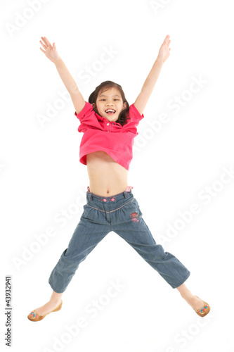 Studio Shot Of Chinese Girl Jumping In Air