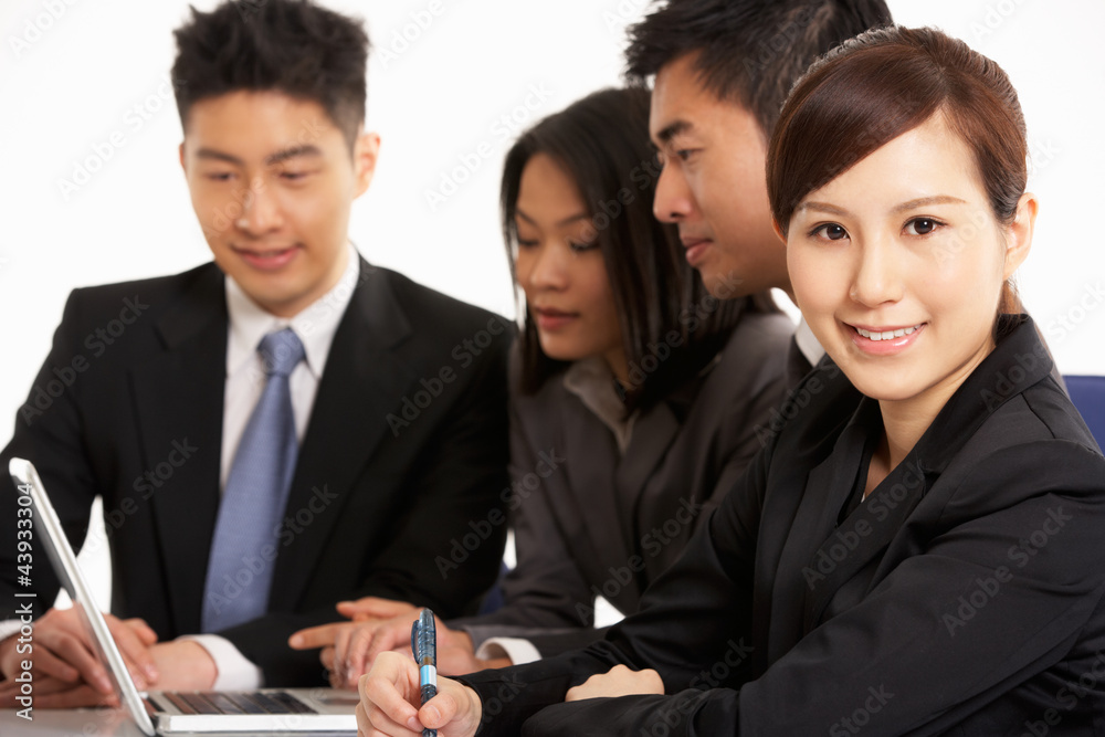 Studio Shot Of Chinese Businesspeople Having Meeting Studio Shot Of Chinese Businesspeople Having Meeting