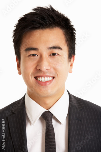 Studio Portrait Of Chinese Businessman