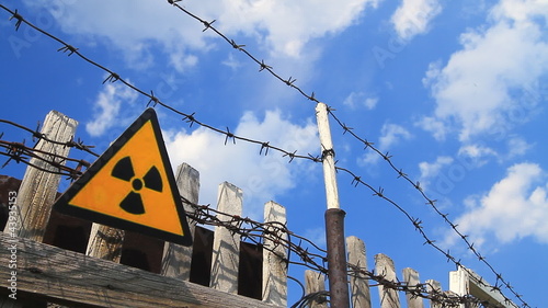 Radioactivity Sign and barbed wire.