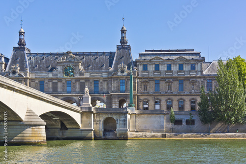 View of famous museum Louvre from the Seine River. Paris, France