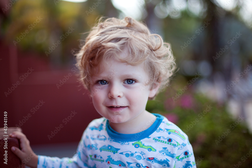 Sweet baby boy with blond hairs after sleeping in pajamas Sweet baby boy with blond hairs after sleeping in pajamas