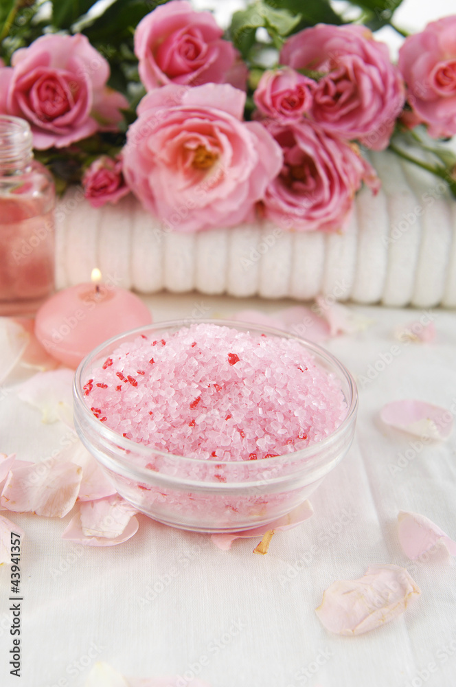 branch rose on towel with salt in bowl on white towel branch rose on towel with salt in bowl on white towel
