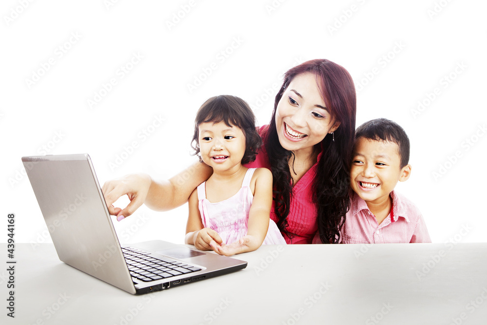 Happy family with ultrabook laptop