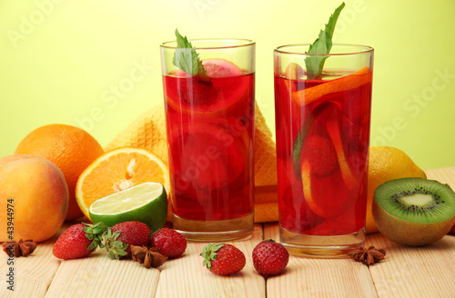 Refreshing sangria in glasses with fruits,