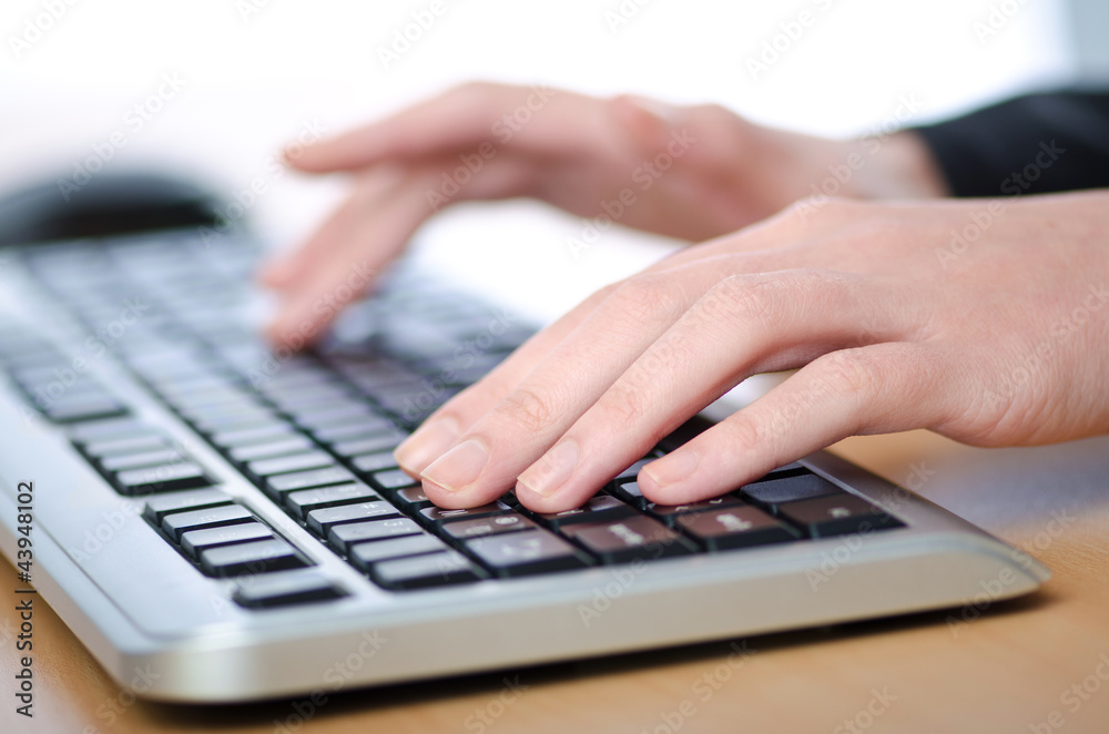 Hands typing on the keyboard Hands typing on the keyboard