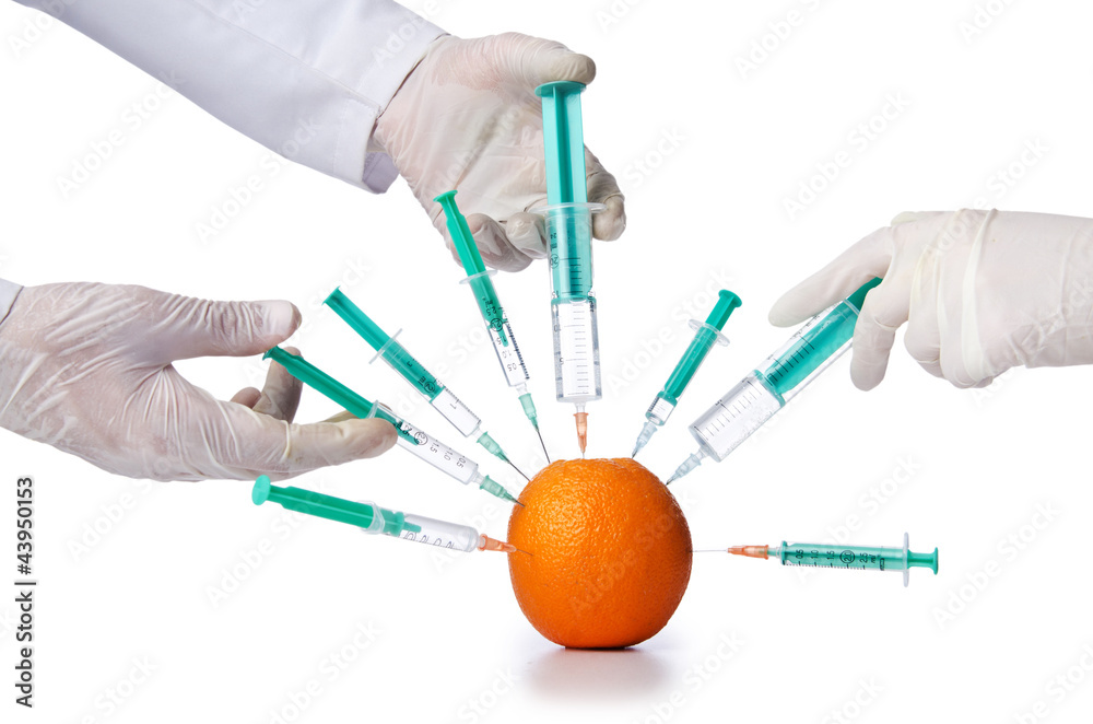 Science experiment with orange and syringe Science experiment with orange and syringe