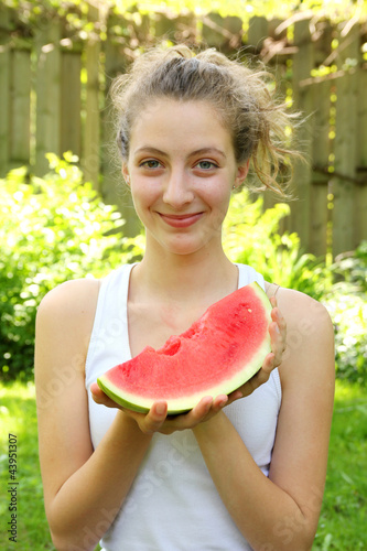 Teen eating watermelon
