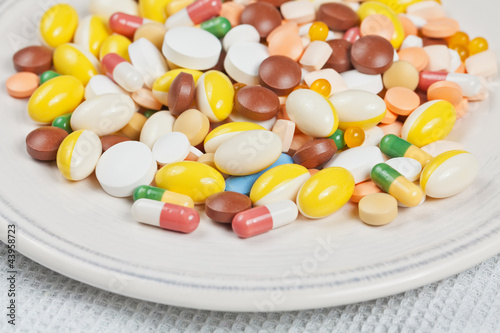Plate filled with medicine pills and capsules