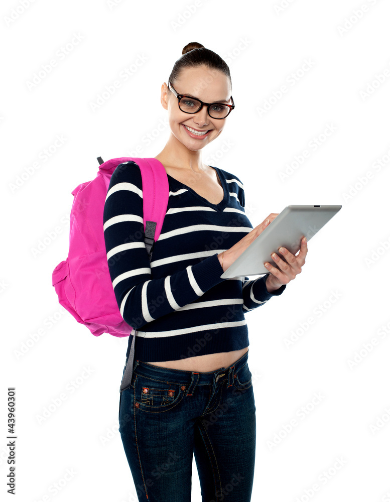 Female student playing on touch screen device Female student playing on touch screen device