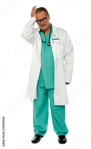 Full length shot of unhappy doctor in uniform