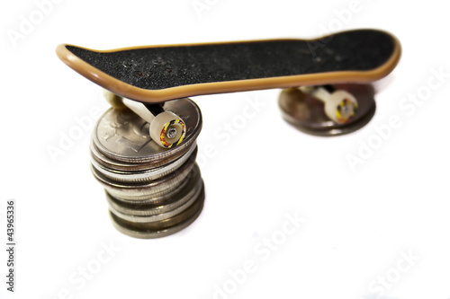 Some coins on fingerboard photo