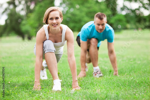 Couple working out in park