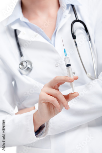 Doctor holds a syringe, healthcare concept, isolated on white